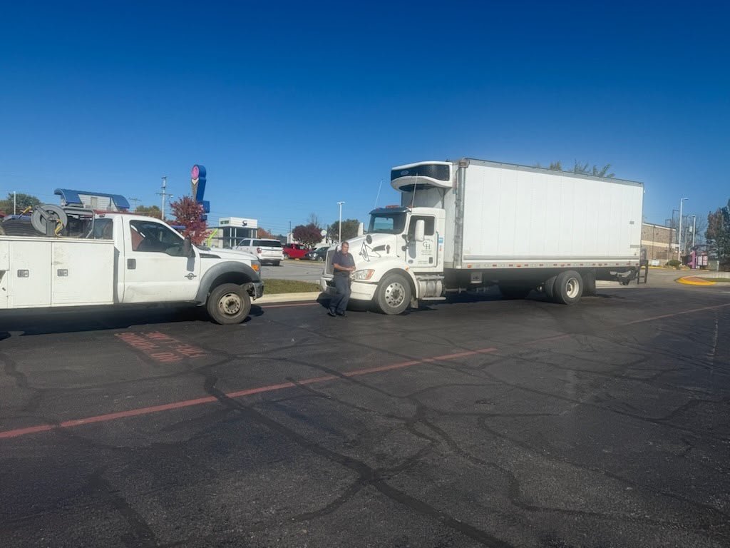 Mobile service truck assisting a box truck on-site
