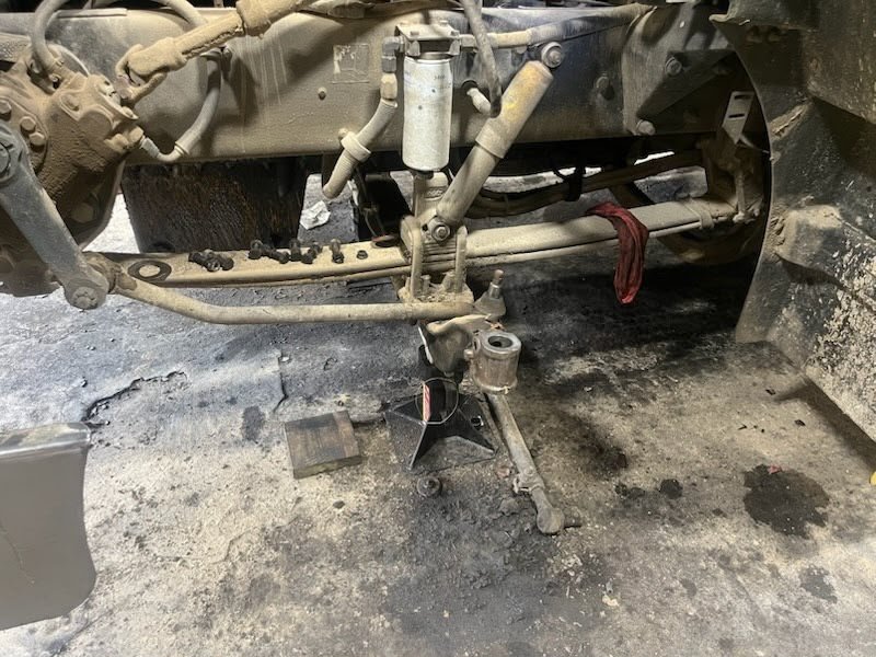 Truck axle and suspension repair in progress